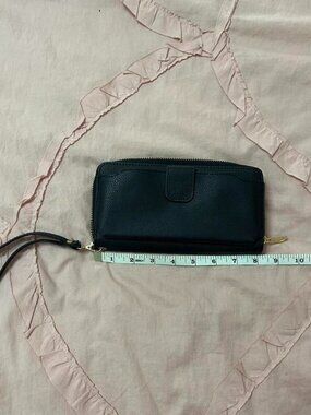 Black leather wallet with wrist strap.